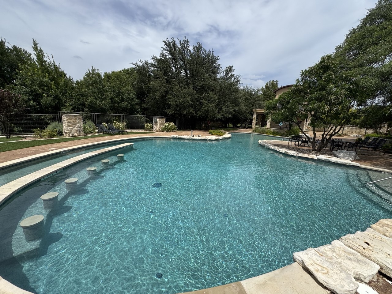 Belle Pools cared-for residential pool and outdoor living area