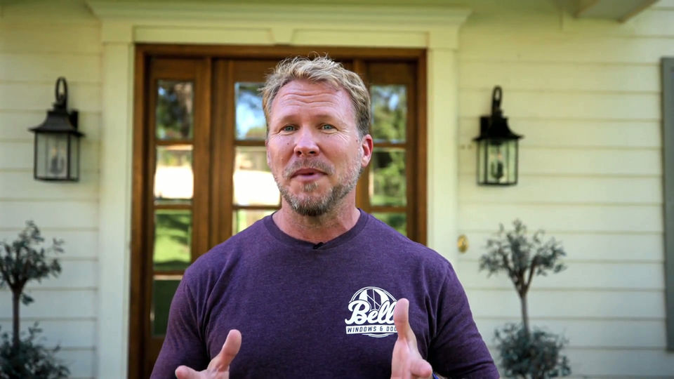 Belle technician working on a home exterior